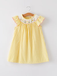 Yellow and white striped dress for girls with smocked neckline and chick floral embroidery.