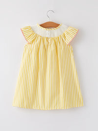Yellow and white striped girls dress with smocked neck and flutter sleeves on hanger