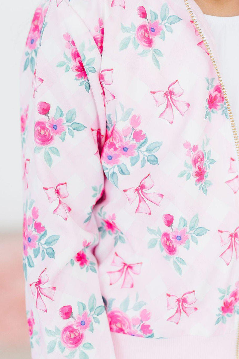 Close-up of the Gingham Bows Satin Jacket, highlighting the delightful floral print and cute pink ribbons, ideal for stylish little trendsetters.