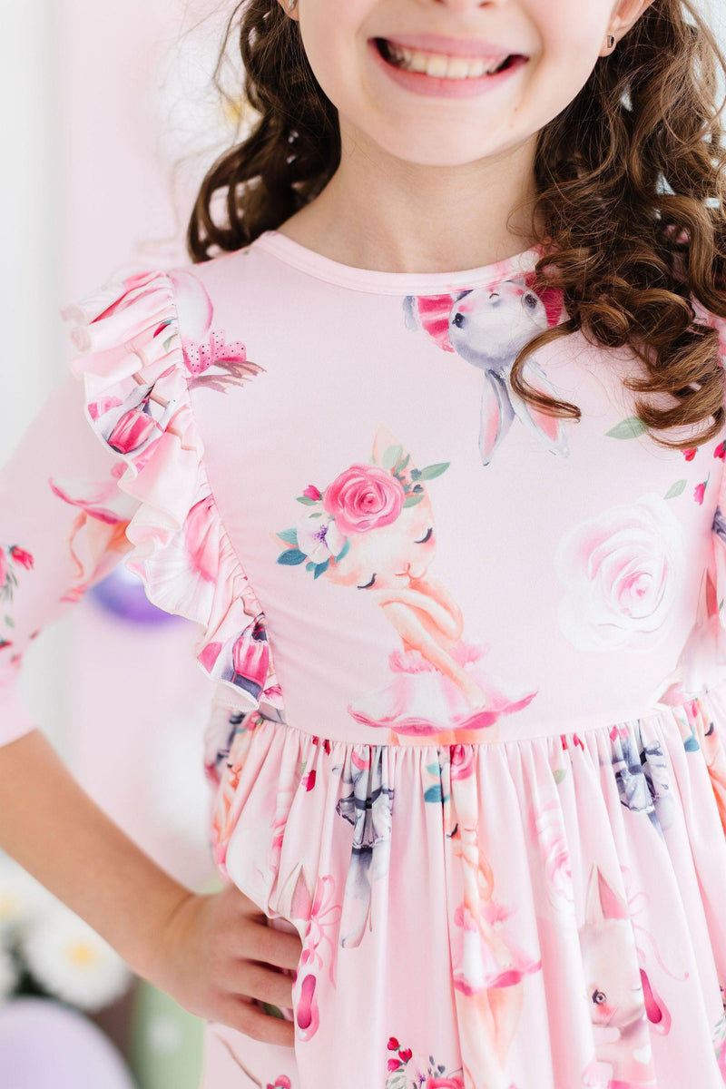 Close-up view of the elegant ballet neckline and scoop back of the Ballet Beauties Ruffle Twirl Dress by Mila & Rose, ideal for young dancers.