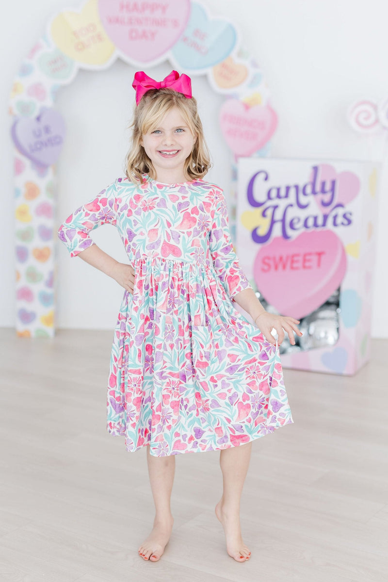 Back view of the Watercolor Hearts 3/4 Sleeve Pocket Twirl Dress highlighting the scoop back design.