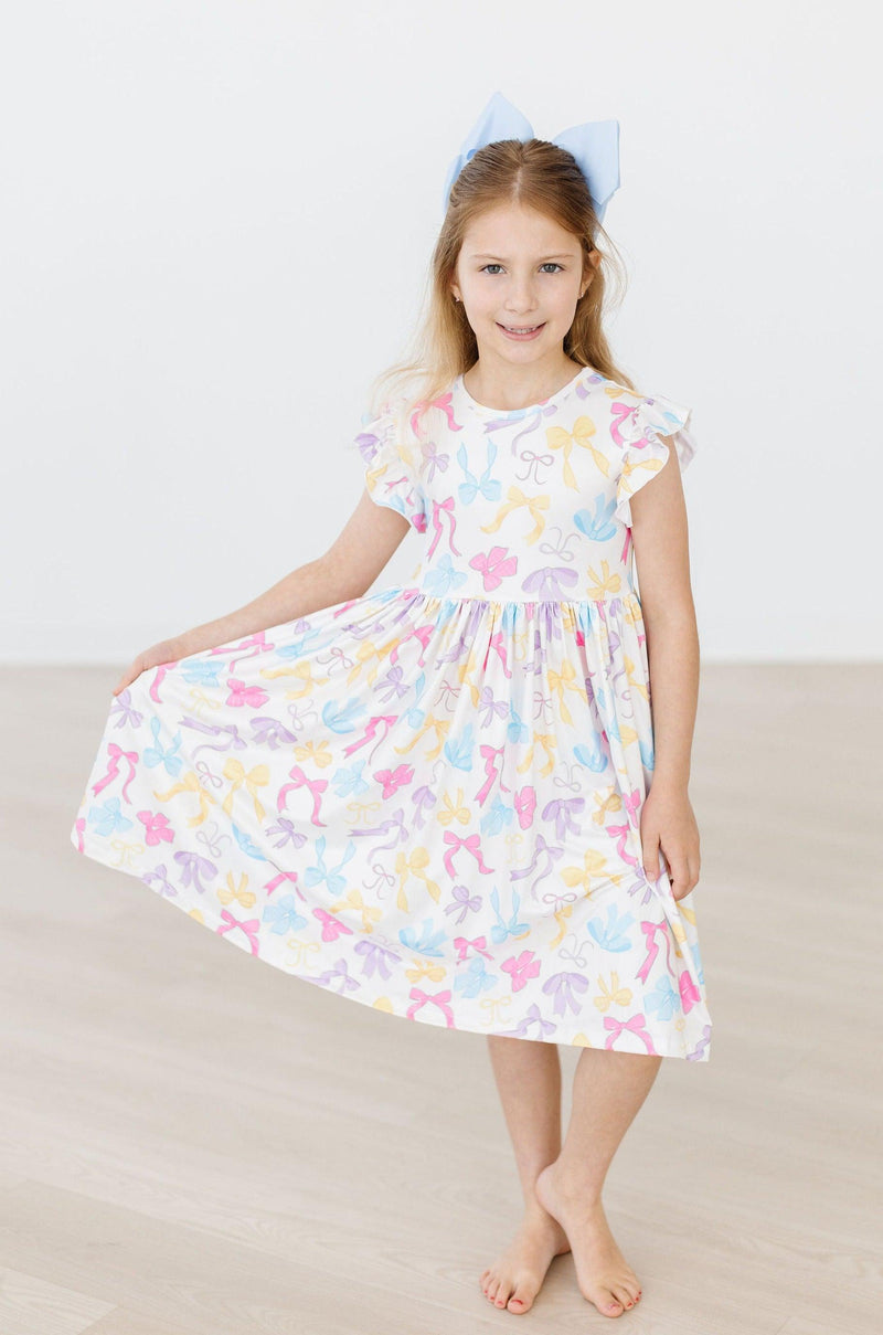 Bow-tastic Flutter Sleeve Twirl Dress by Mila & Rose® in vibrant colors, designed for little girls to twirl and play comfortably.