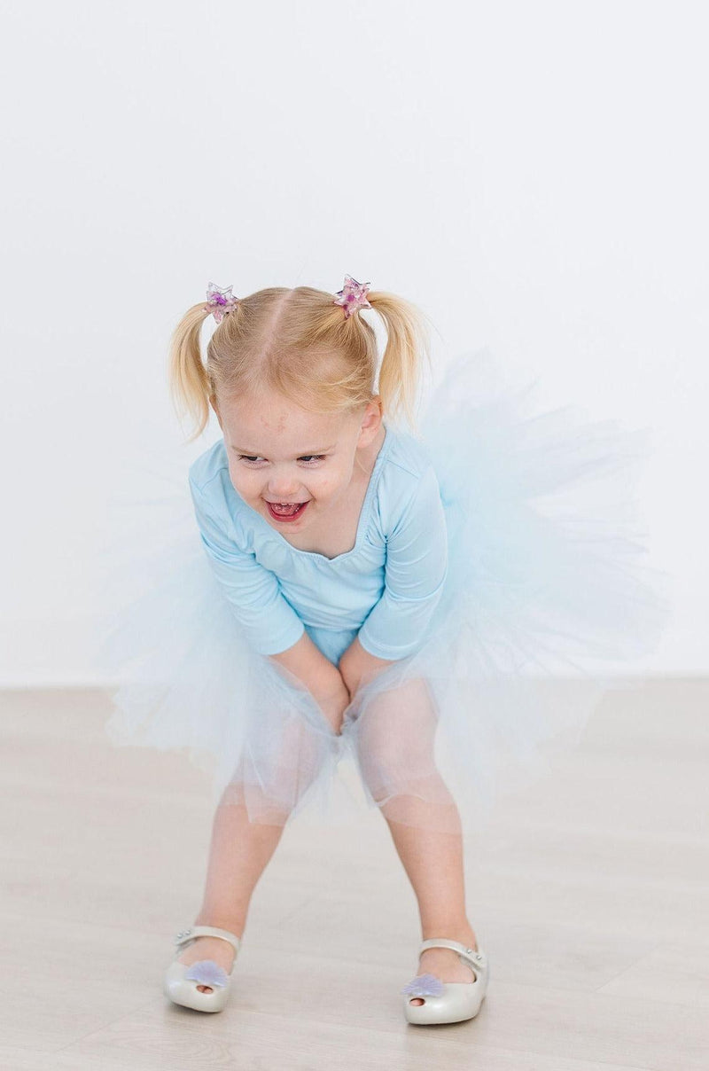 Group of young dancers wearing the Bluebird 3/4 Tutu Leotard by Mila & Rose®, enjoying a dance class and looking cheerful.