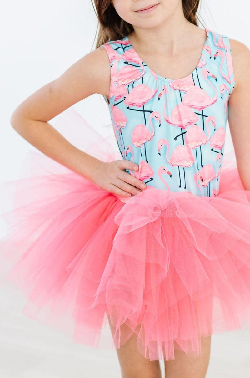 Close-up of a girl in the Pretty in Pink Flamingos Tank Tutu Leotard from Mila & Rose, highlighting the charming flamingo design and fluffy pink tutu, ideal for twirling and fun.