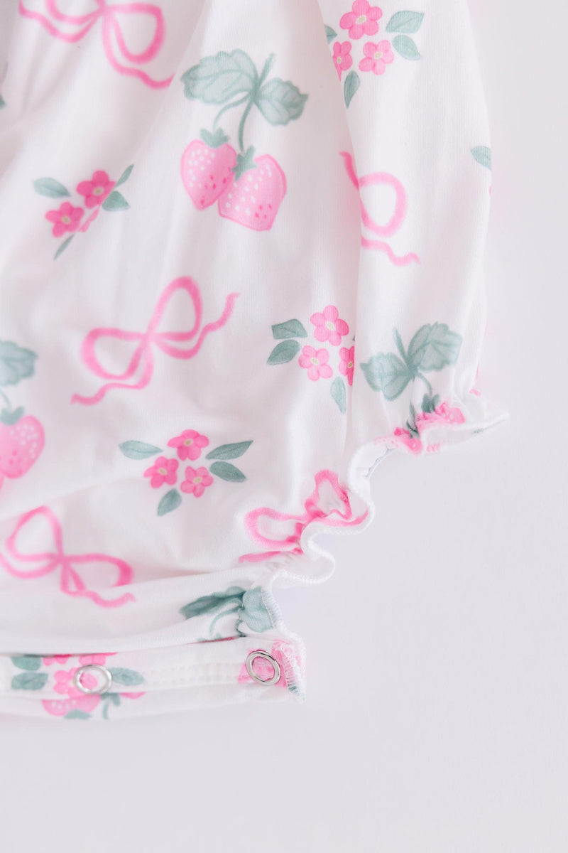 Berries & Bows Ruffle Cross Back Romper from Mila & Rose in a vibrant summer design with crisscross back and ruffle details perfect for toddler play.