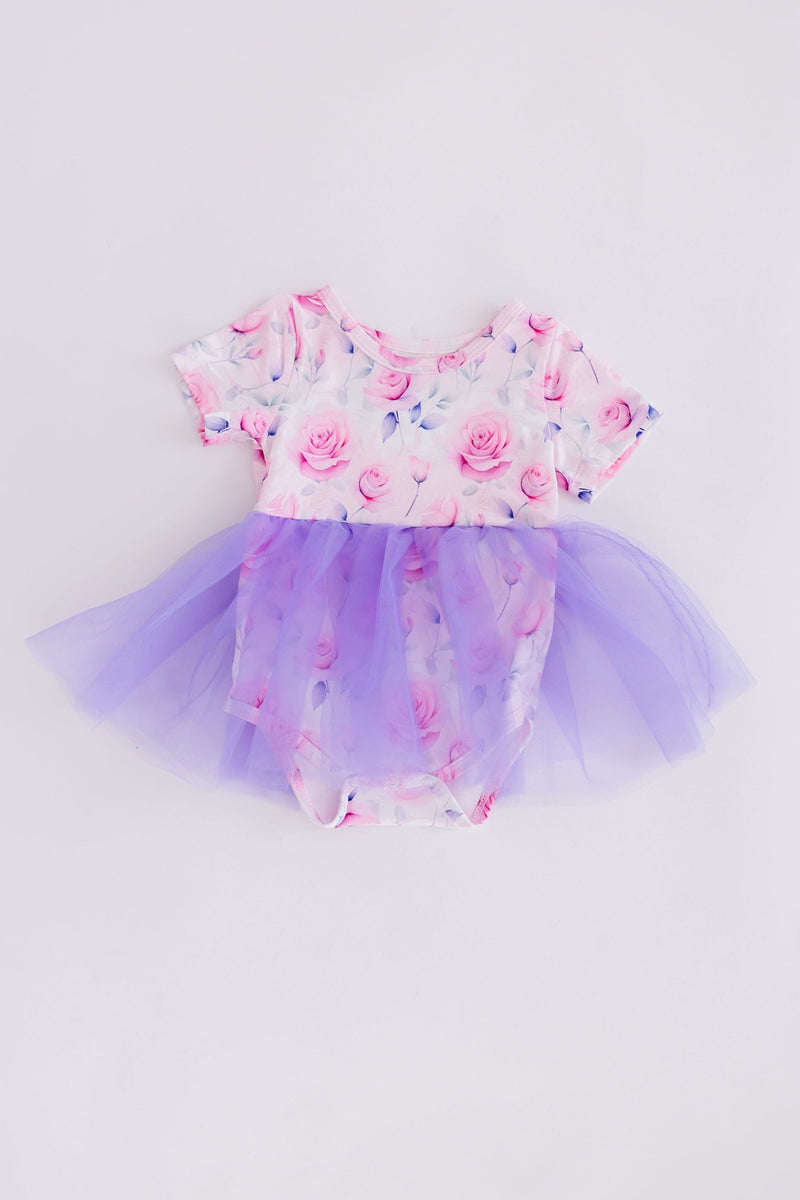 SALE Rose Garden Tutu Bodysuit featuring a floral design with pink roses and a layered purple tulle skirt, perfect for little girls' special occasions.