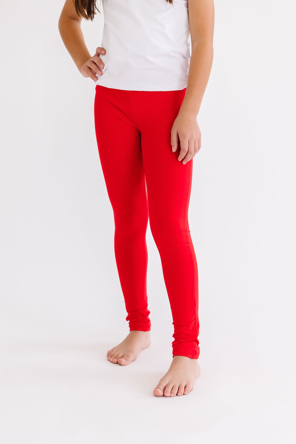 Red Slim-Fit Leggings for Girls, showcasing a stylish and comfortable fit, perfect for various outfits and occasions. Ideal slim fit leggings for active little ones.