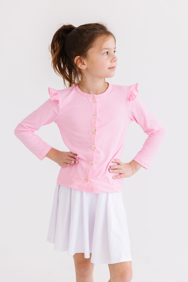 Close-up view of the Bubblegum Pink Ruffle Cardigan for Girls highlighting its soft texture and delightful ruffles that make it a cozy yet chic choice for any occasion.