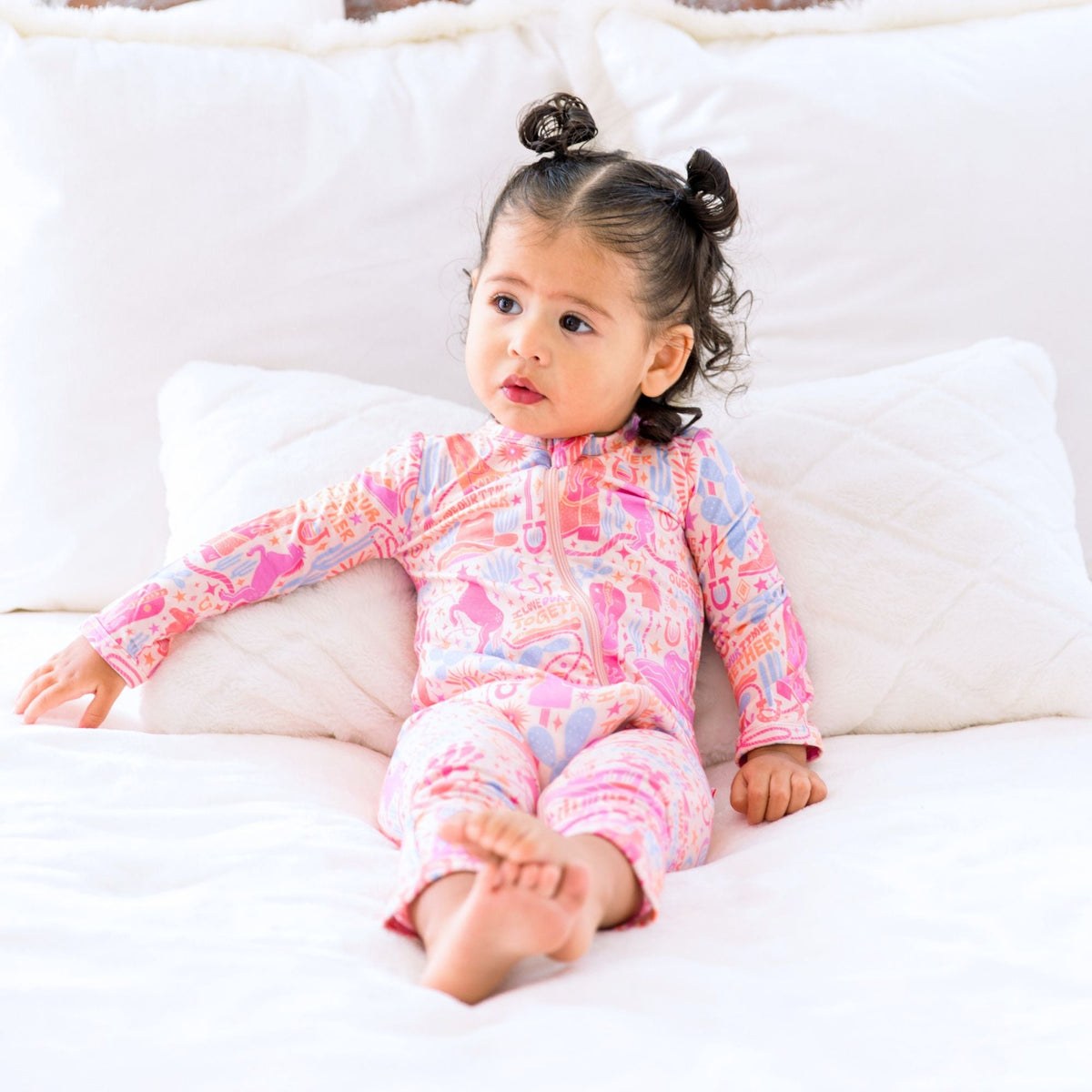 The footless design of the Second-Skin Footless Romper | Saddle Up Western Themed, allowing babies to move freely, an ideal bamboo baby romper for early walkers.