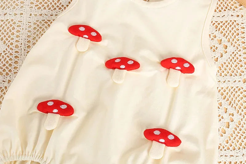 Cream 3D baby romper for infants with red mushroom applique details
