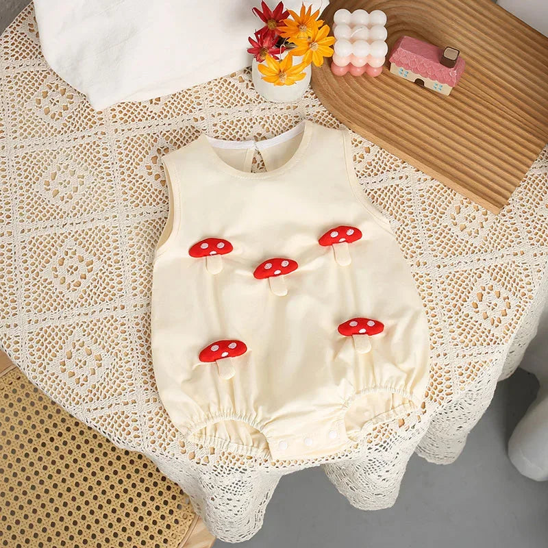Cream 3D baby romper with red mushroom details for infants 0 to 12 months