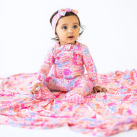 Comfort and style with The Forever Large Swaddle Blanket in Saddle Up design, perfect for infants.