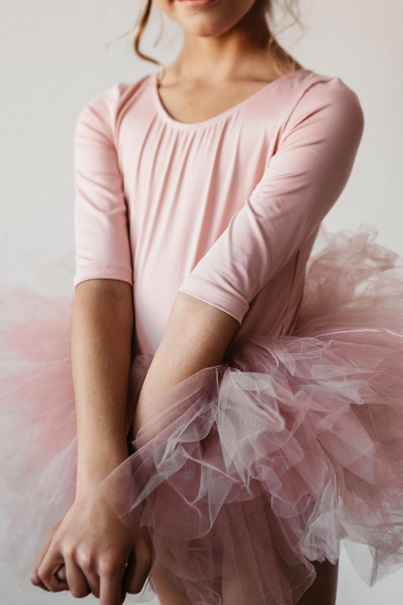 Close-up of the Vintage Pink 3/4 Fluffy Tutu Girls Dance Leotard fabric highlighting its cozy polyester blend.