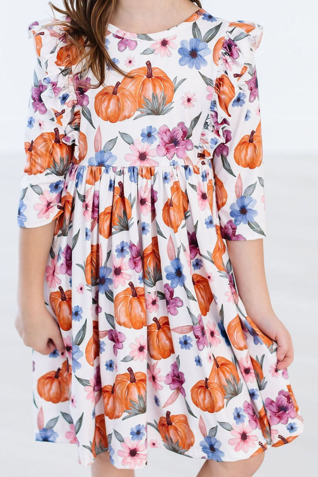 Hey Pumpkin 3/4 Sleeve Ruffle Twirl Dress in a vibrant floral and pumpkin print, perfect for little girls who love to twirl and shine!