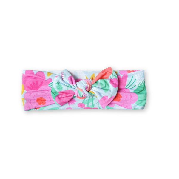 The SoftKnot Baby Bow Head Wrap - Babies and Toddlers - Flower Power. Close-up view showcasing the soft bamboo fabric of the softknot baby bow head wrap.