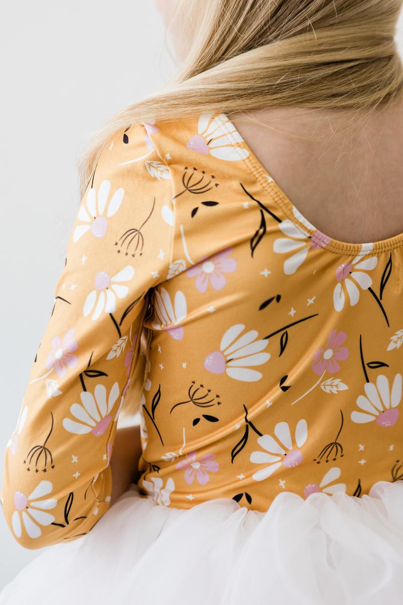 Close-up of the back design of the Dandelions in Fall 3/4 Tutu Leotard by Mila & Rose®, featuring a floral print and comfortable fit, perfect for little dancers.