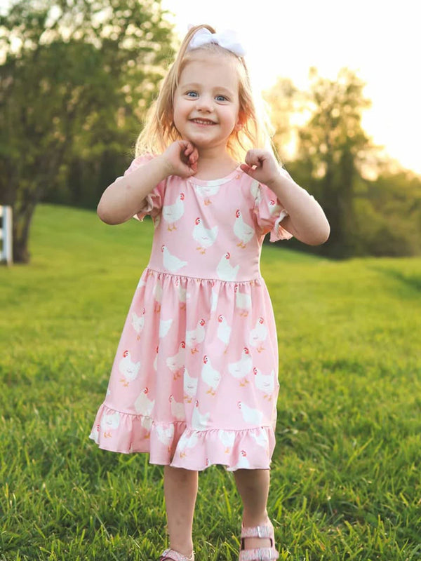 Comfortable and stylish Farm Spring Girls Chicken Print Dress Ruffle In Pink with ruffle details for a charming look.