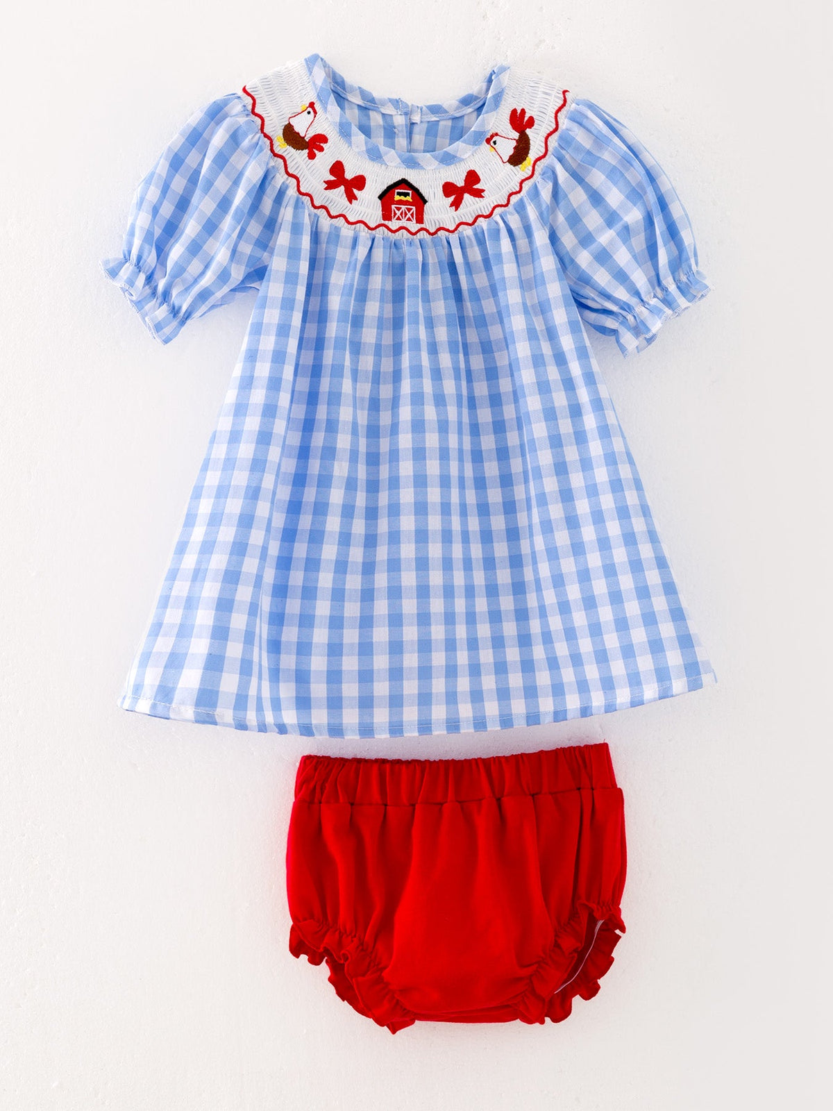 Beautifully styled Farm Smocking Embroidered Girls Outfits ready for festive occasions, spotlighting the embroidered smocking dress.