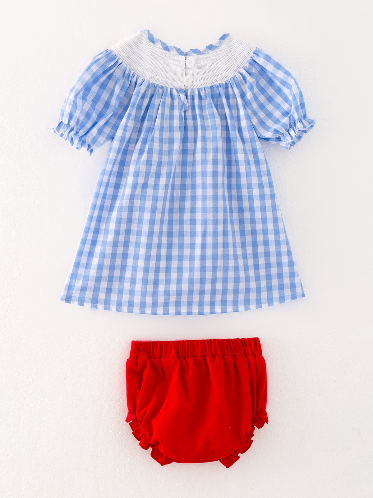 Full view of the embroidered smocking dress from Rylee Faith Designs, perfect for family gatherings and special events.