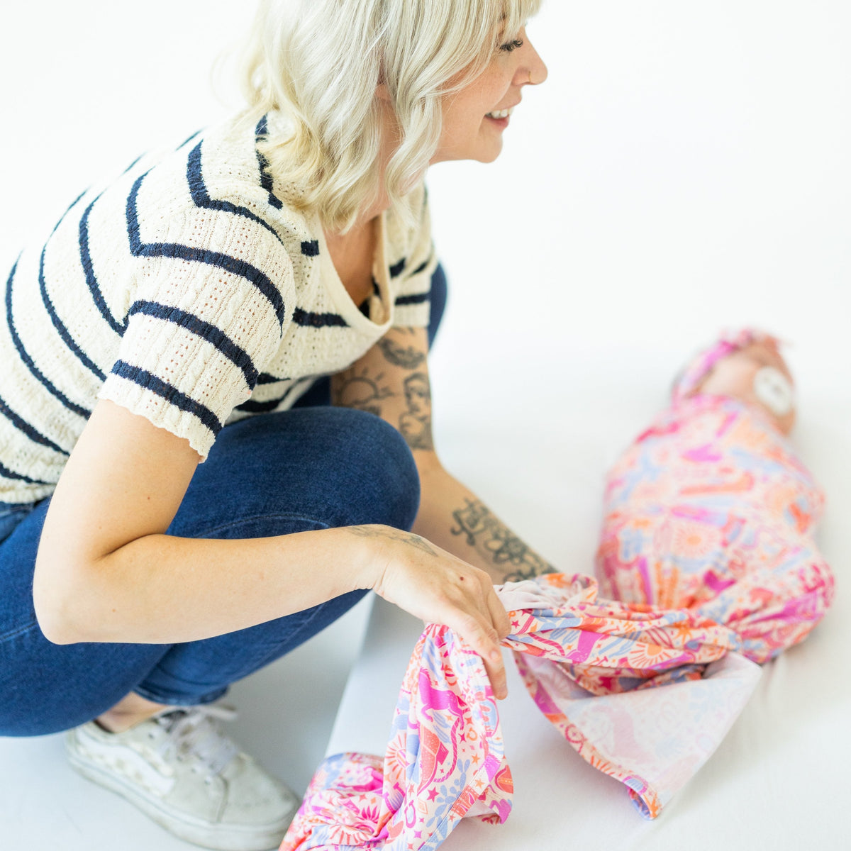 The Forever Large Swaddle Blanket in Saddle Up Western theme, the perfect cozy layer for your baby.