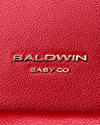 Crimson pebbled vegan leather texture with silver Baldwin Baby Co logo on the Daphne diaper bag.
