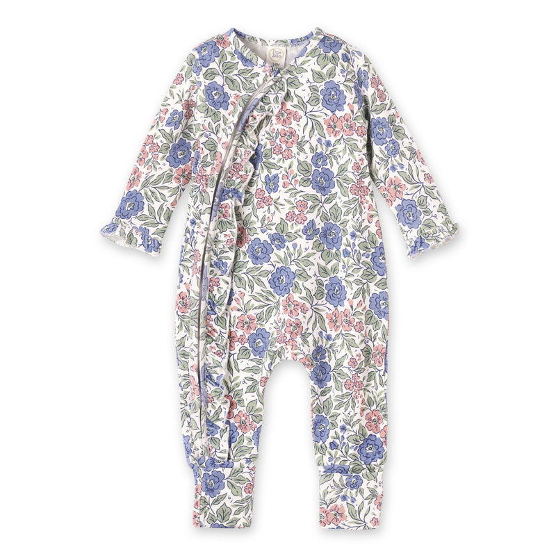 Vintage floral baby romper with front zipper and ruffles. Soft bamboo-spandex blend in blue and pink Florabelle print for comfort.