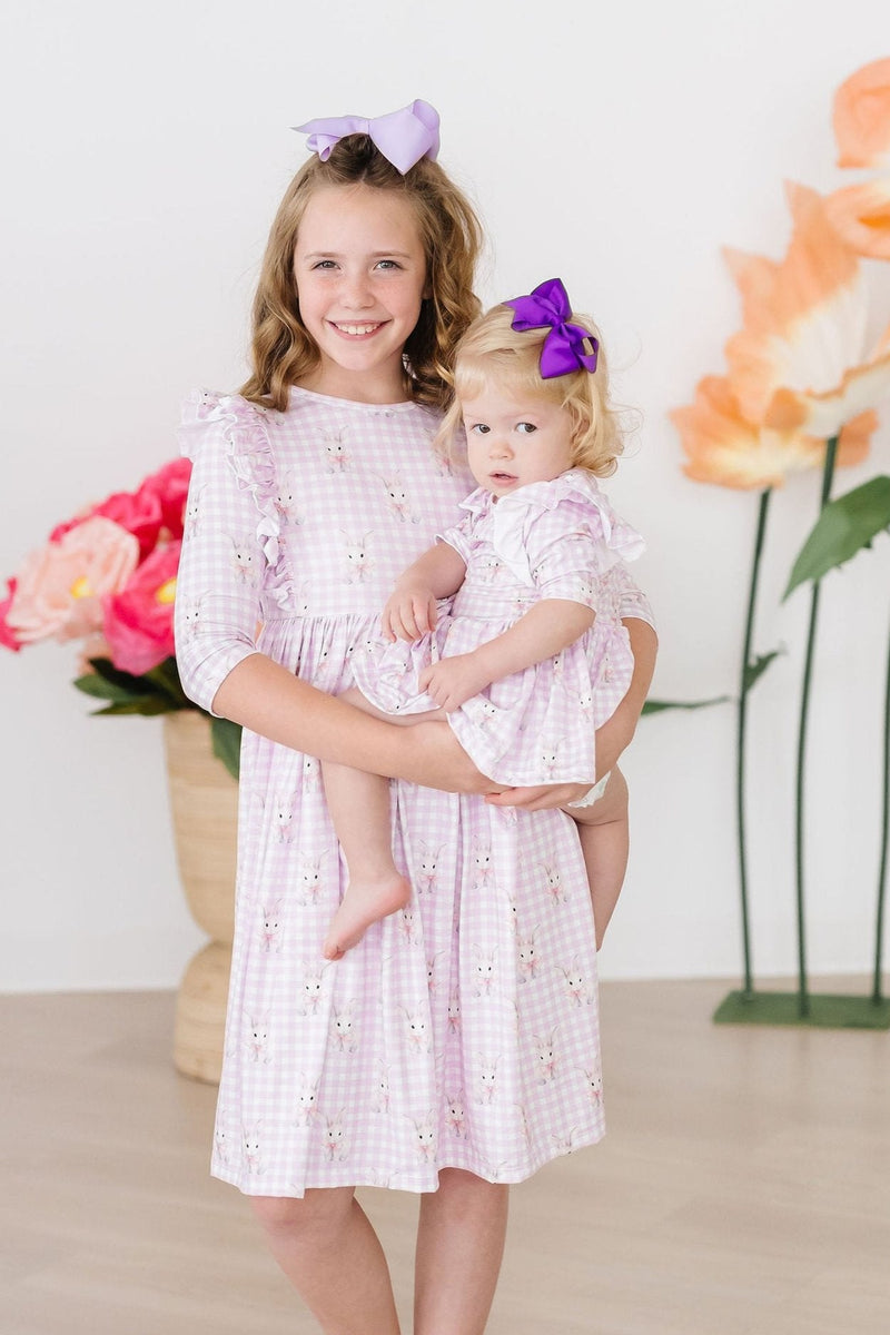 Lovely Baby Bunnies 3/4 Sleeve Ruffle Twirl Dress from Mila & Rose, styled with a vibrant pattern, ideal for playdates and family gatherings.