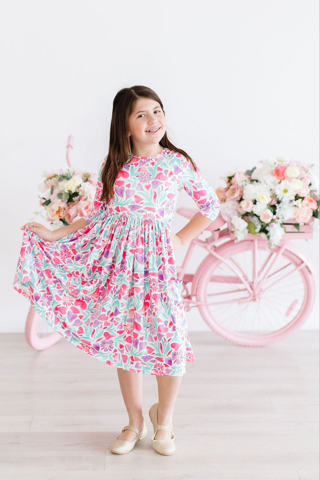 Watercolor Hearts 3/4 Sleeve Pocket Twirl Dress displayed on a model showcasing its playful design.