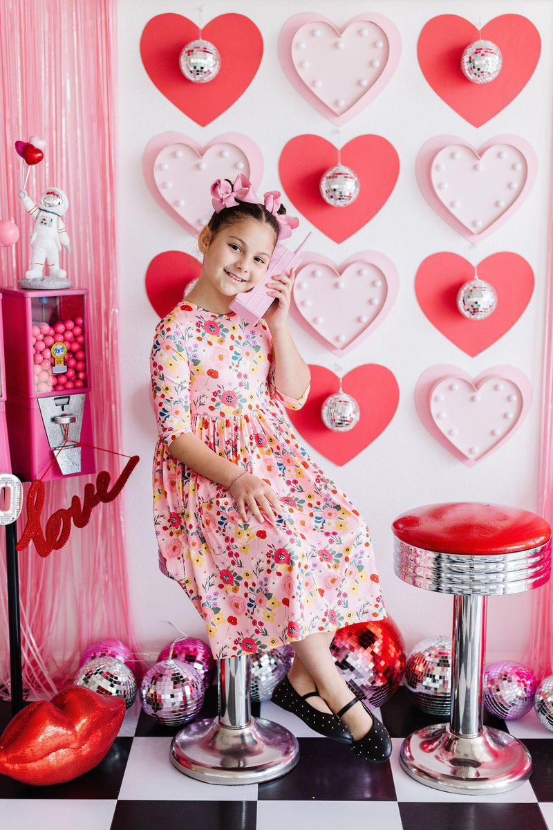 Bouquet Beauty 3/4 Sleeve Pocket Twirl Dress for Girls in vibrant floral print, perfect for active play and special occasions by Mila & Rose.