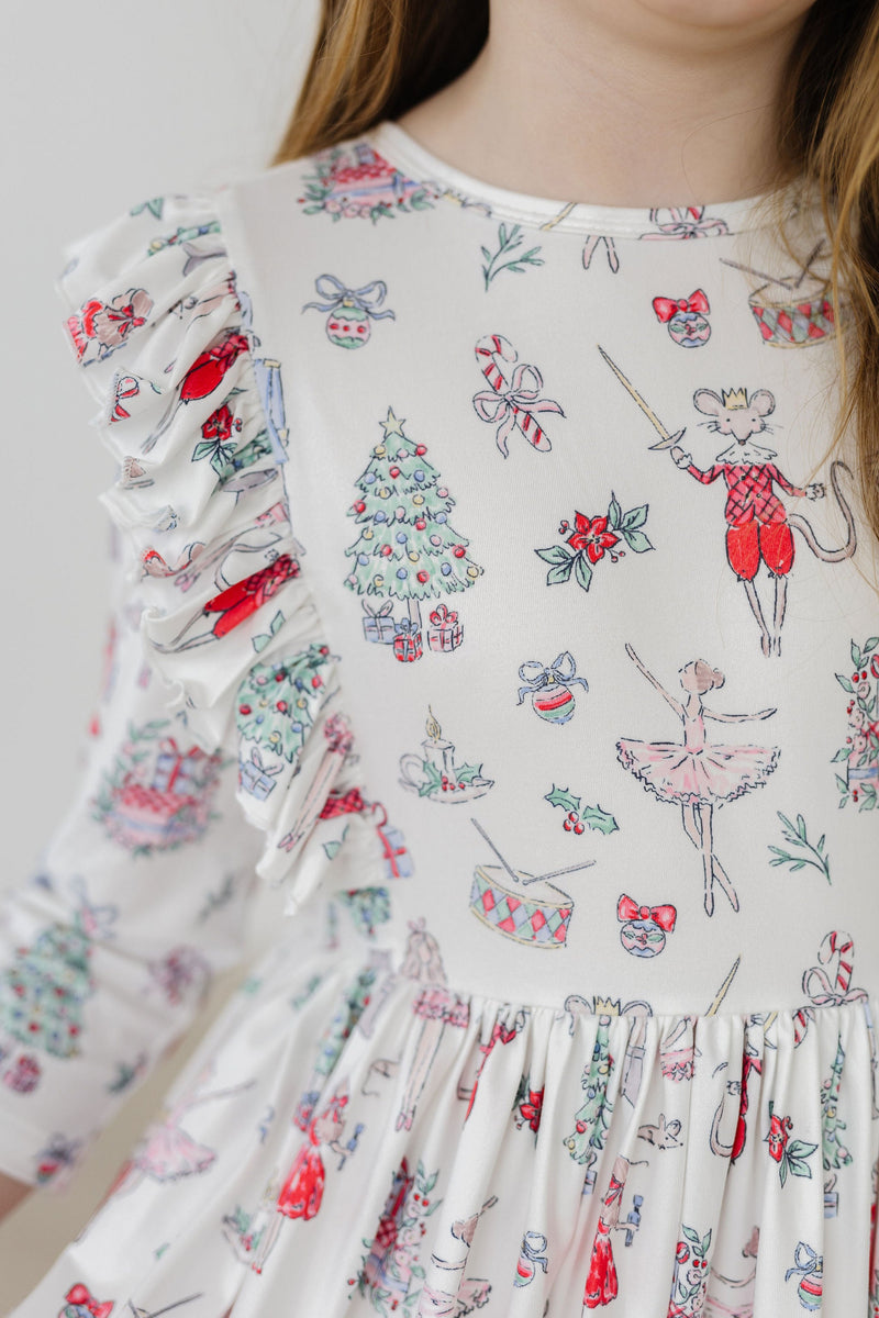Clara's Christmas 3/4 Sleeve Ruffle Twirl Dress featuring a whimsical holiday print with festive characters and a ruffled sleeve detail, perfect for little girls.