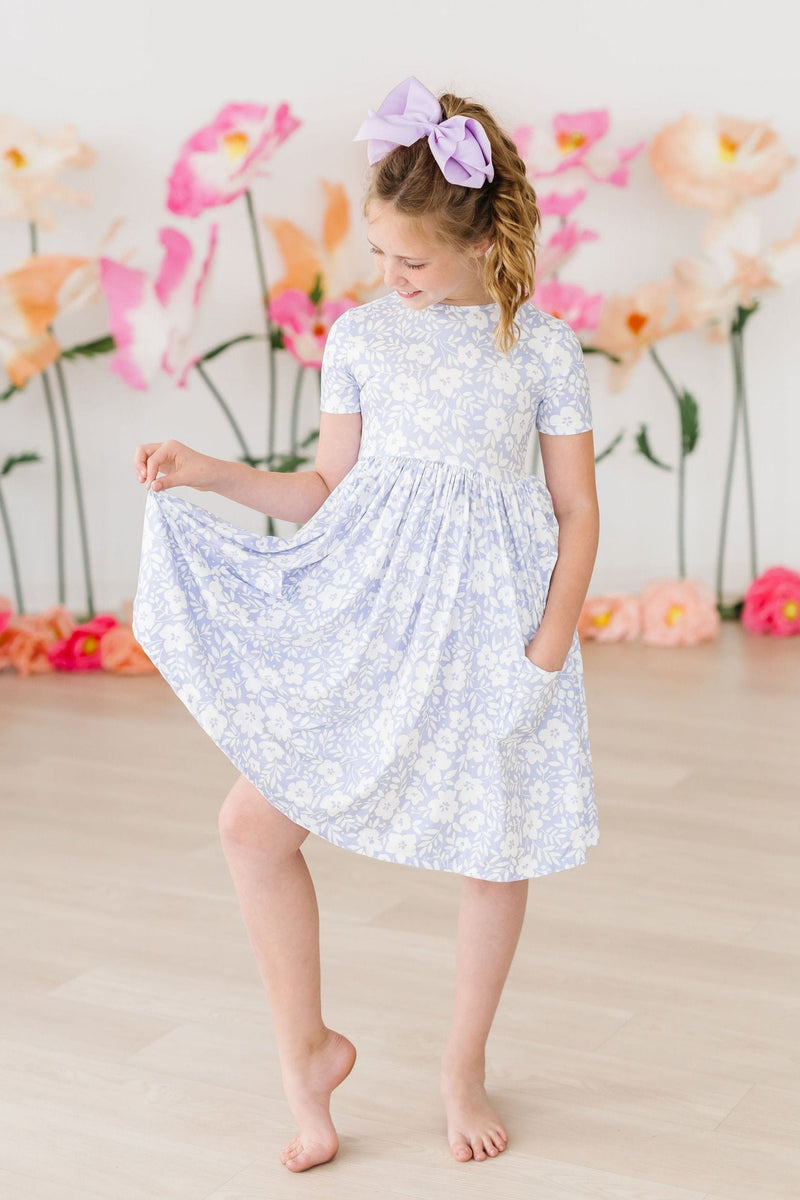 Blossom Bliss S/S Pocket Twirl Dress by Mila & Rose, featuring a comfortable fit, scoop back design, and playful twirl style perfect for little girls' adventures.