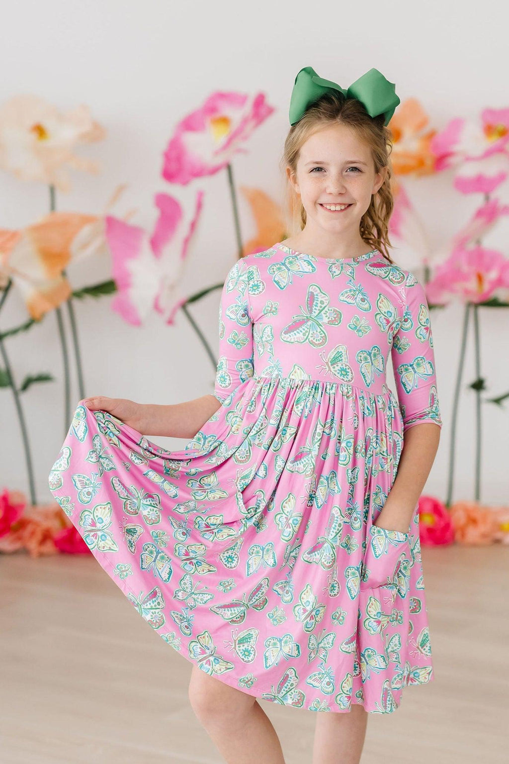 Butterfly Garden 3/4 Sleeve Pocket Twirl Dress for Girls by Mila & Rose, featuring colorful butterfly prints perfect for twirling at playdates and special events.
