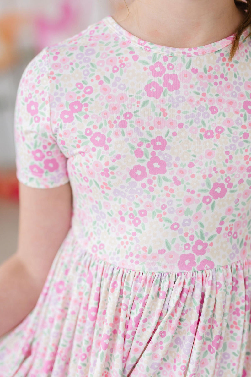 Close-up of the Blooming Beauty S/S Pocket Twirl Dress details, highlighting the soft fabric and comfortable fit for active children.