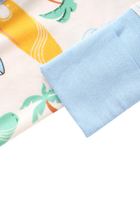 Light blue fabric square on a colorful background with palm tree designs