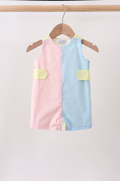 Pastel pink and blue color-block baby jonjon in 100% cotton with yellow pockets.