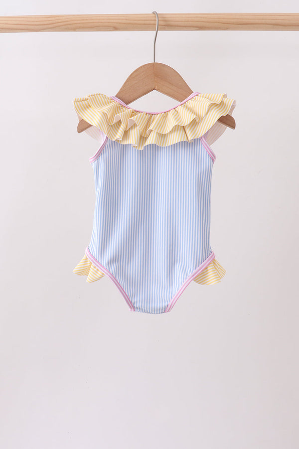 Blue stripe ruffle one-piece swimsuit for girls with yellow neckline and side ruffles, pink trim.