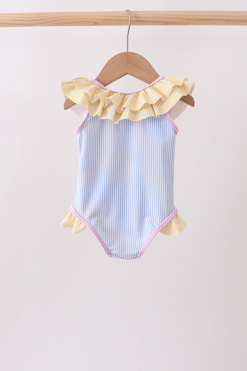 Blue stripe ruffle one-piece swimsuit for girls with yellow neckline and side ruffles, pink trim.