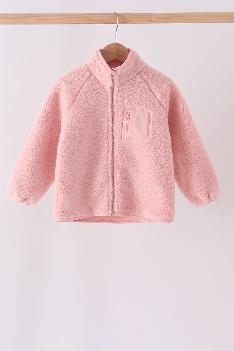 Soft pink fleece jacket with full-length zipper and zippered chest pocket, perfect for cozy layering on cool days.