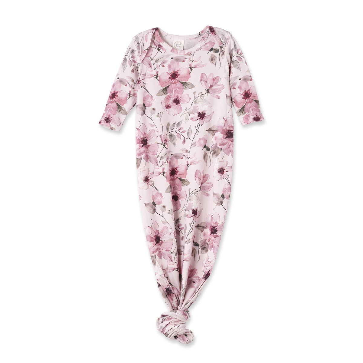 A baby footed sleeper with long sleeves and a knotted ankle, featuring a pink and purple floral pattern on a pale pink background.