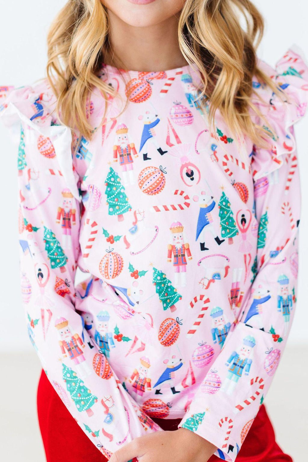 Sugarplum Fairy Long Sleeve Ruffle Tee from Mila & Rose featuring vibrant prints and whimsical ruffles, perfect for playful occasions.