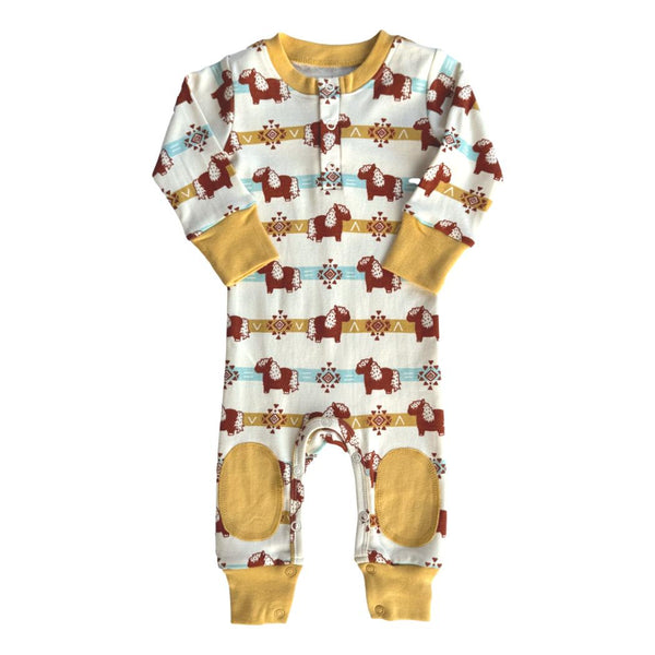 GOTS certified organic cotton crawler playsuit featuring an Aztec pony print with mustard yellow cuffs and reinforced knee patches.