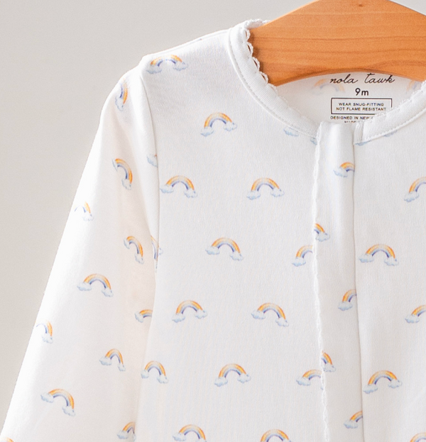 Baby outfit with rainbow pattern on a hanger