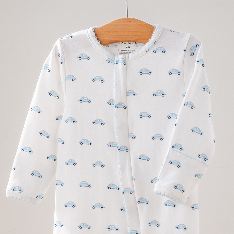 Little Blue Wheels organic cotton baby pajamas with an all-over print of blue cars.