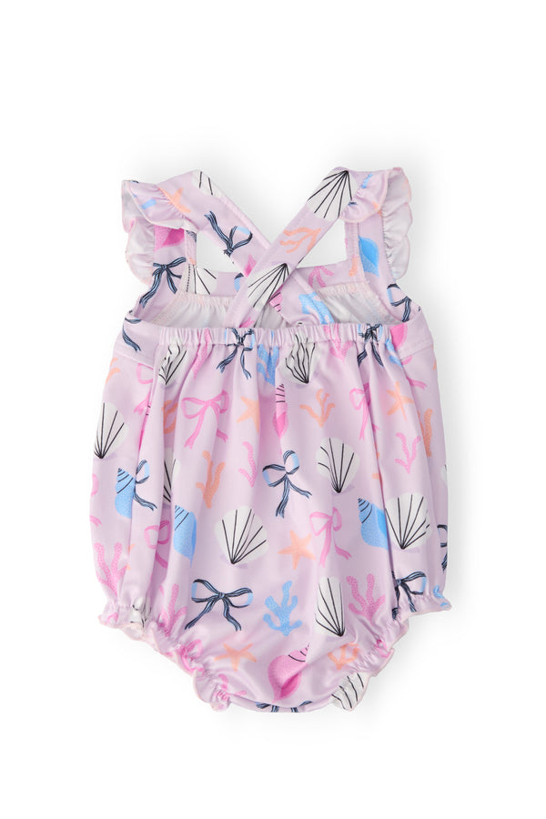 Beachside Bows Ruffle Cross Back Romper, pink seashell and starfish print, crisscross back straps with ruffle, snaps