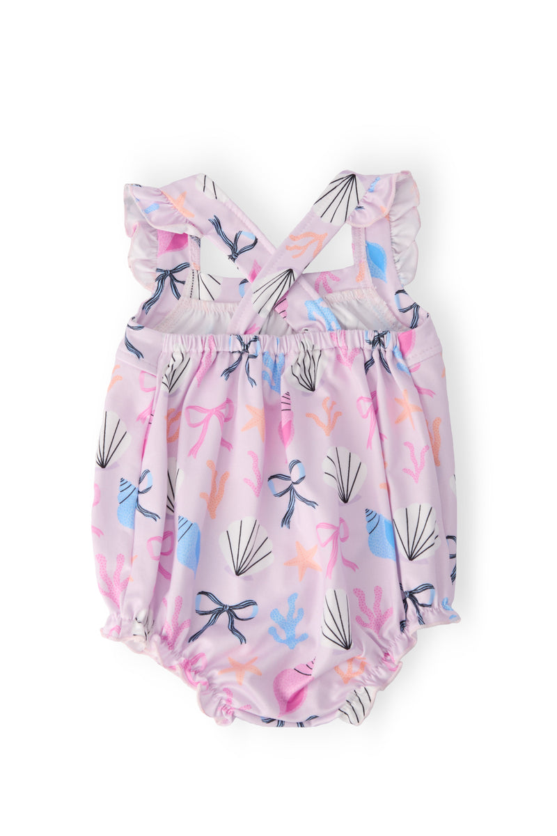 Beachside Bows Ruffle Cross Back Romper, pink seashell and starfish print, crisscross back straps with ruffle, snaps