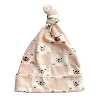 GOTS certified organic cotton knotted baby hat with pink and white checkered bear print design.