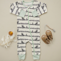 GOTS certified organic cotton zip romper with animal print, mint green trim, sandals, and pacifier clip.