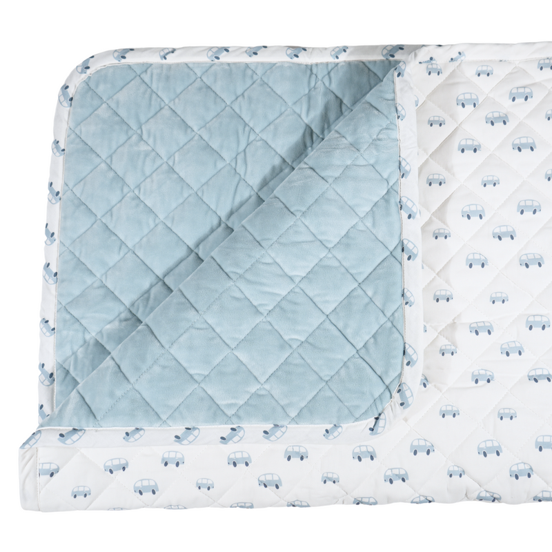 Close-up of the Goosewaddle® Super Soft Play Mats showcasing the plush, quilted texture with a blue underside and car prints.