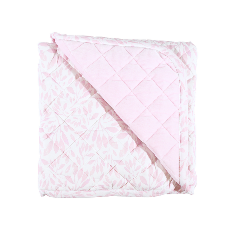 Close-up of Goosewaddle® Super Soft Play Mats folded, showing its soft quilted texture and floral pattern, ideal for providing comfort during play.