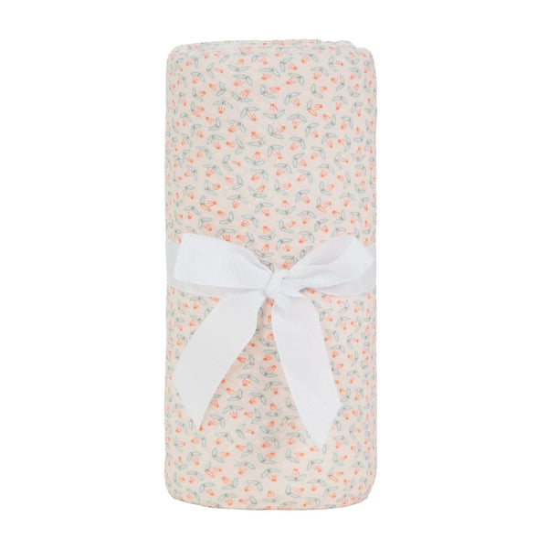 knit blanket in cream with pink and green floral pattern made from soft breathable material